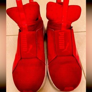 red sneakers by PUMA